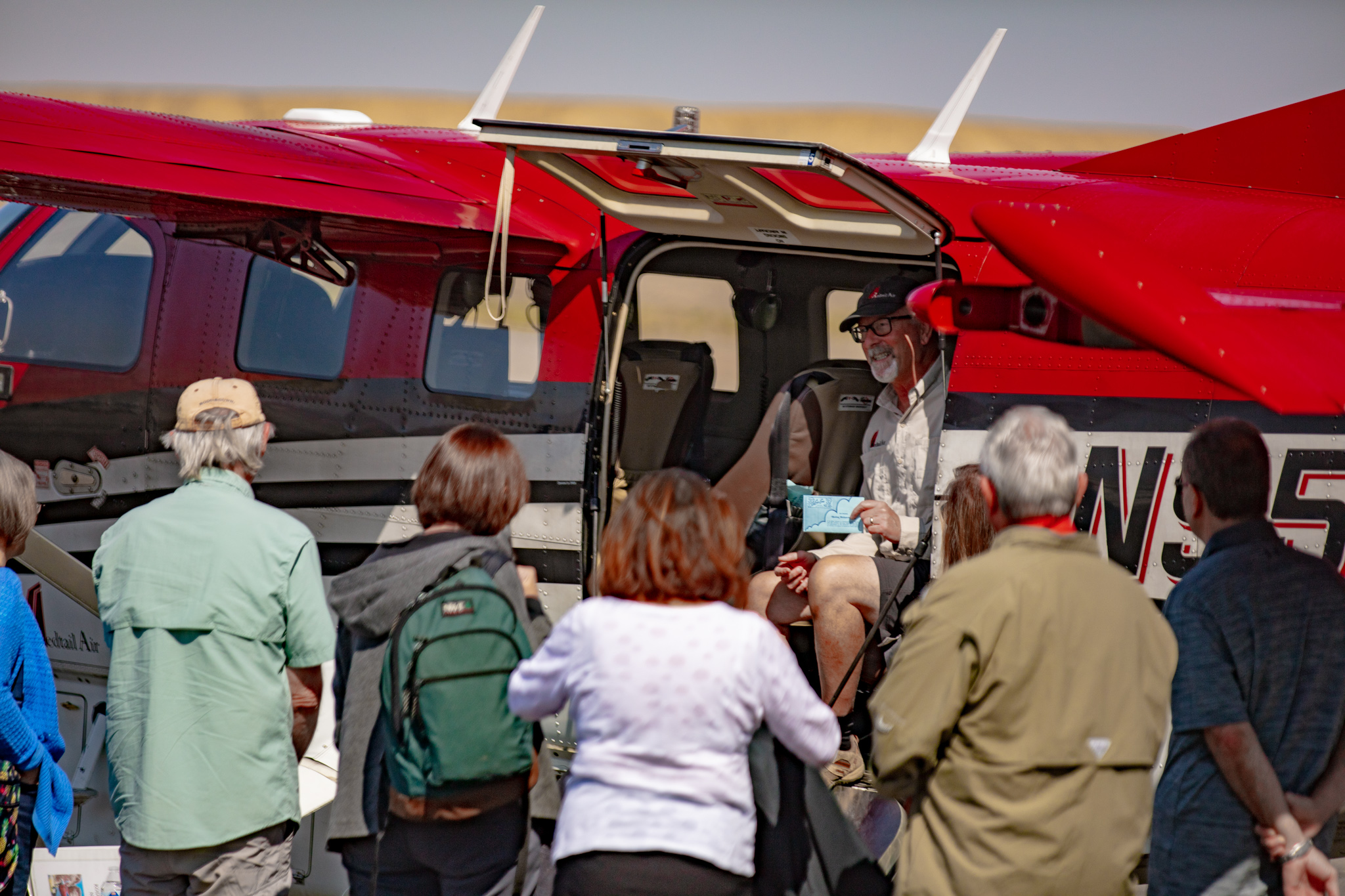 People loading Moab plane