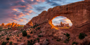 North Window Arch with sunset clouds and Turret Arch in distance
