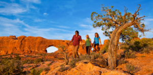 Guide leading guests near North Window Arch in Arches National Park