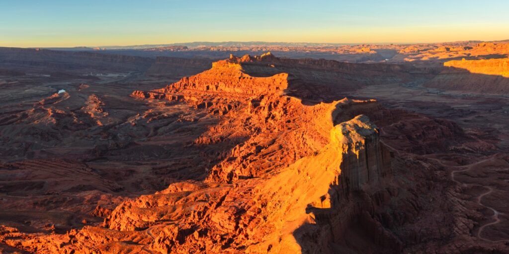 sunset glowing on canyon wall from Anticline Overlook near Hurrah Pass