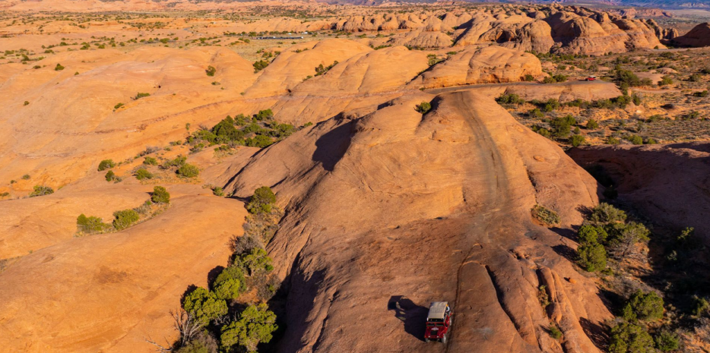 Aerial view of Hell’s Revenge trail across red slickrock